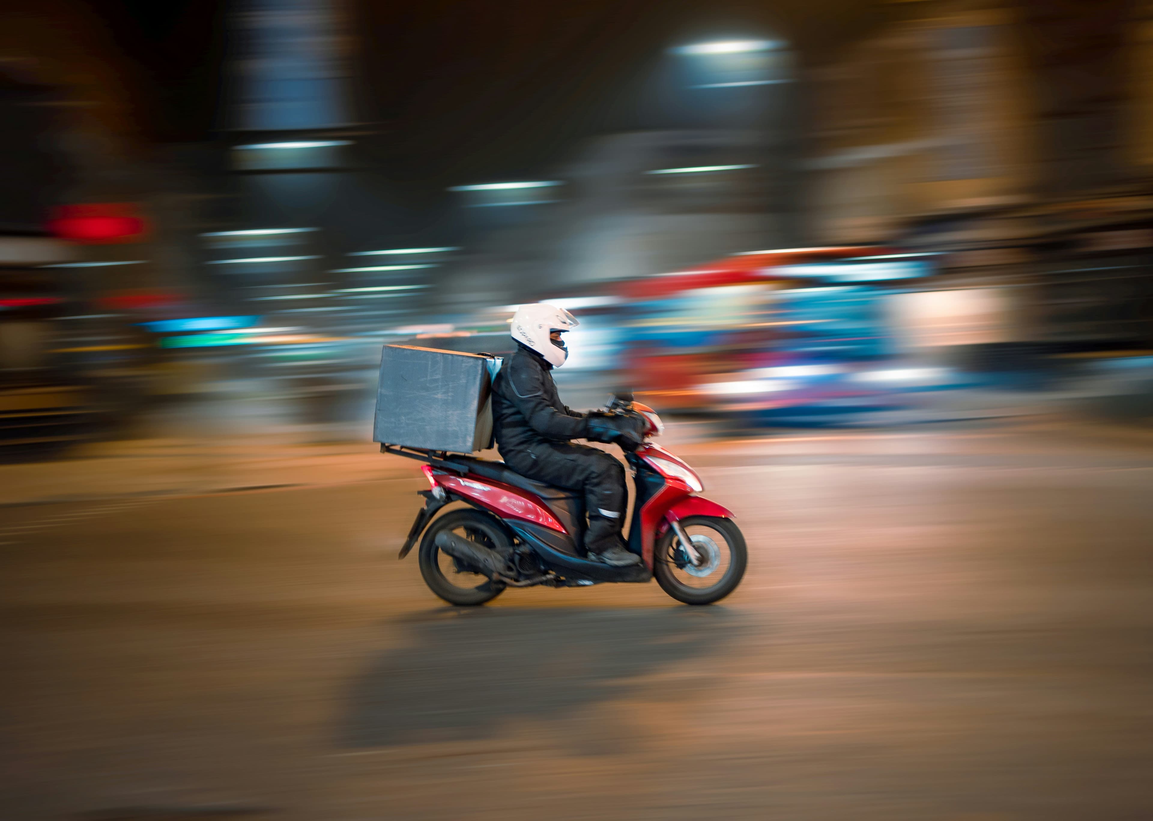Delivery rider on a motorbike